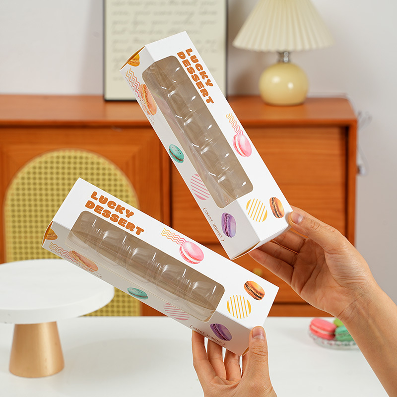 drawer-style packaging box designed specifically for macarons (French almond cookies). The packaging is crafted to highlight the vibrant colors and delicate appearance of the macarons, making it ideal for gifting or retail display.